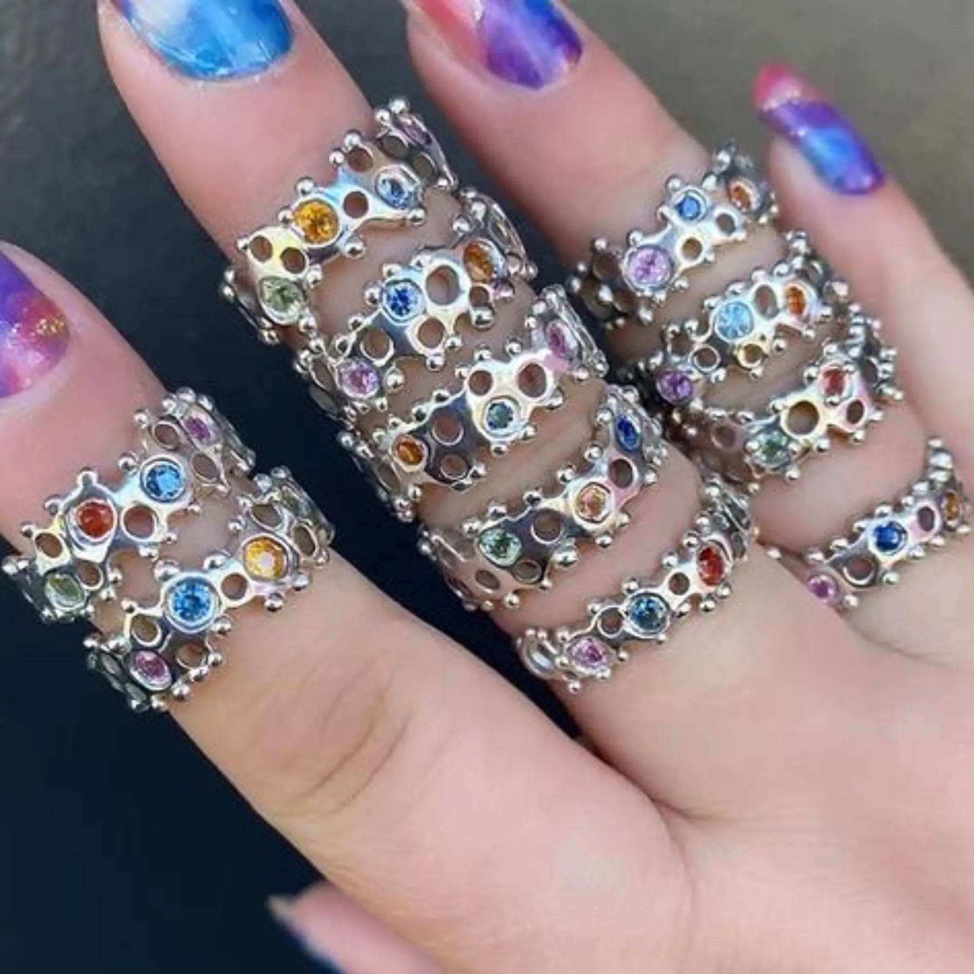 Dazzling silver rings featuring various gemstones, set directly in wax using the popular cast-not-set method, display intricate design and craftsmanship